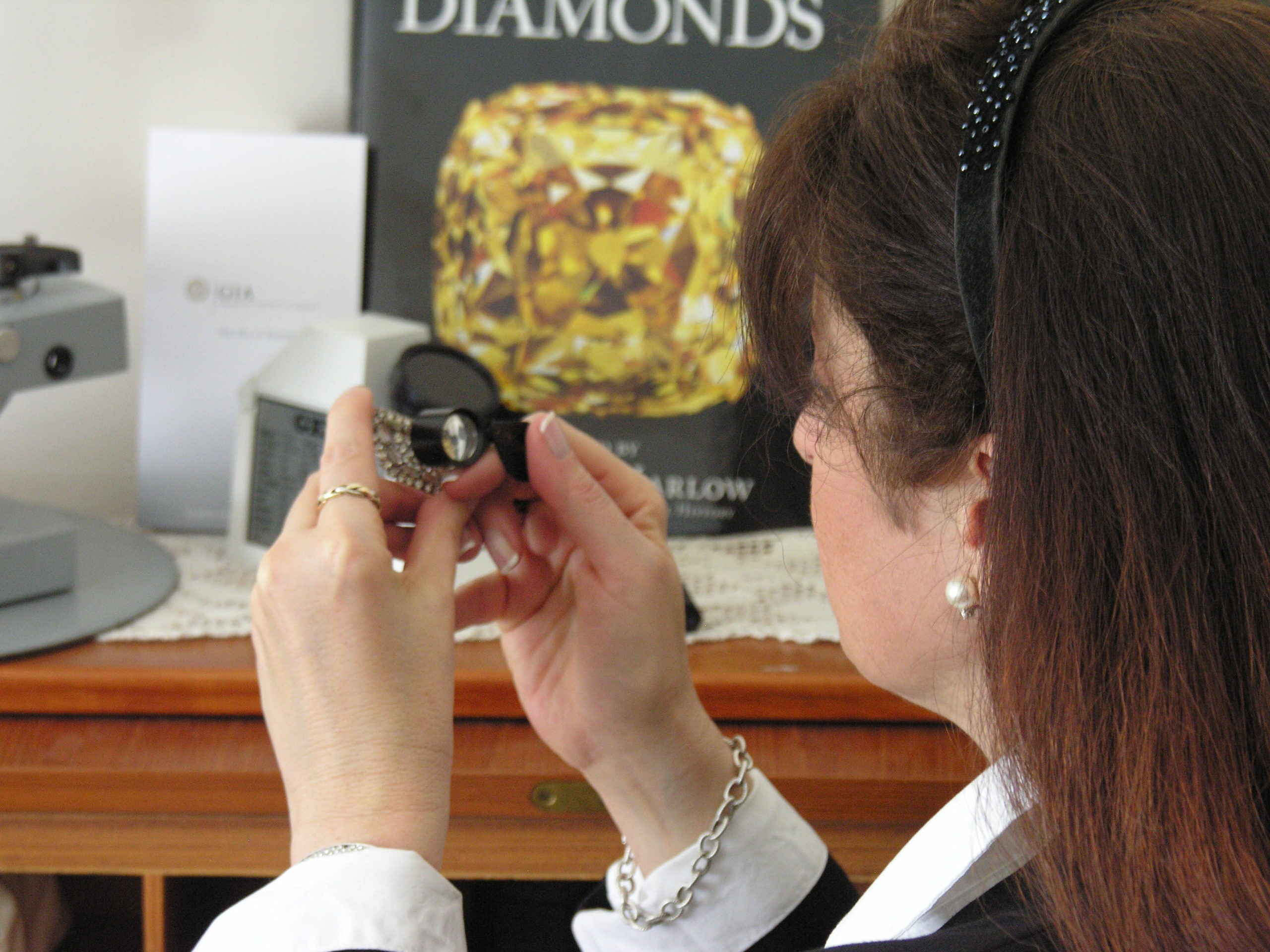 looking at jewelry with a loupe